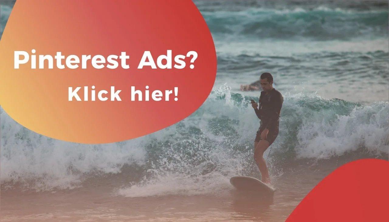 Surfer steht auf seinem Surfbrett und reitet eine mittelgroße welle.