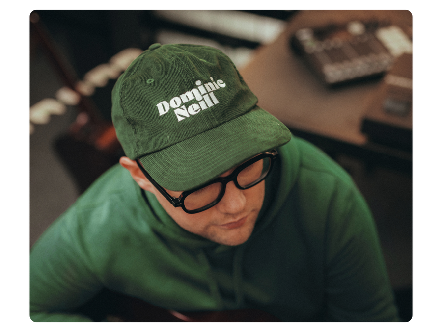 creator wearing a custom embroidered baseball cap to show customization