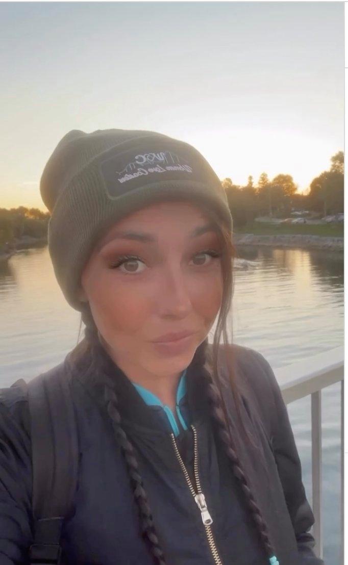 female coaster enthusiast wearing her own print-on-demand printed beanie