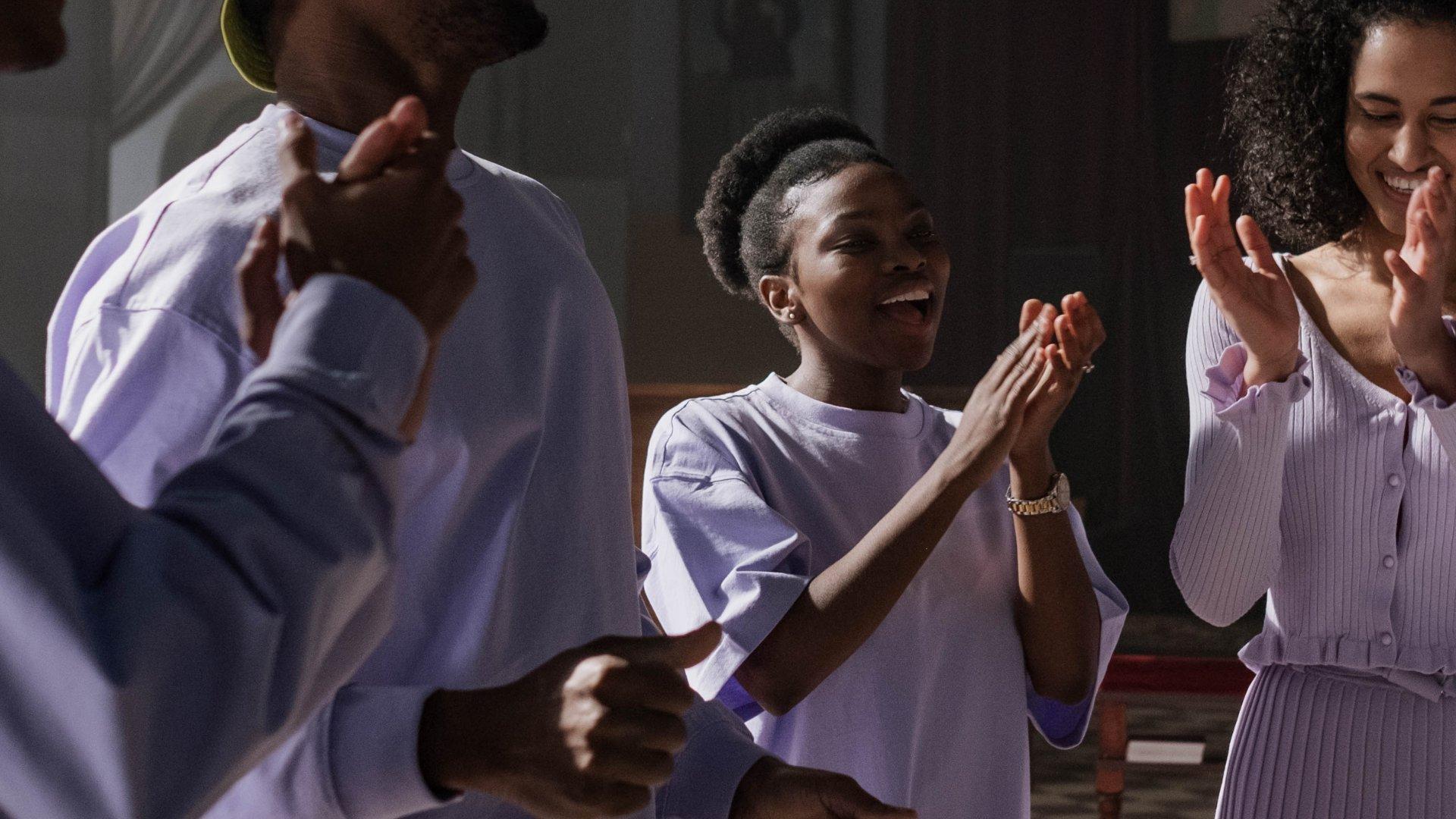 people in a congregation celebrating