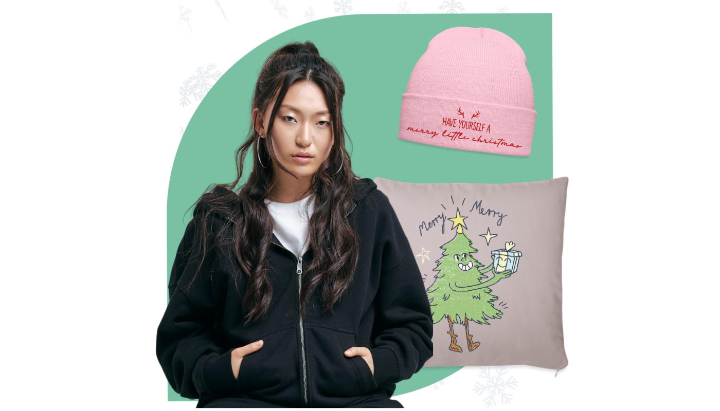 girl wearing hoodie with holiday throw pillow and beanie