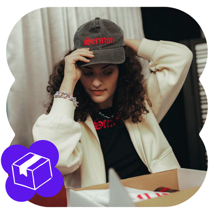 girl putting on an embroidered cap illustrating the selling power of spreadconnect
