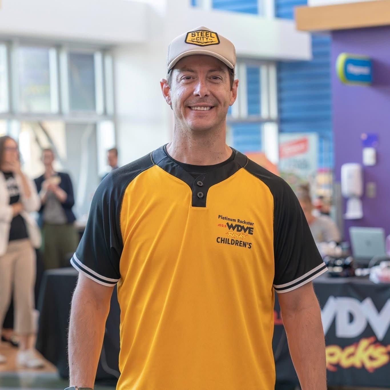 guy wearing fundraising merch at event