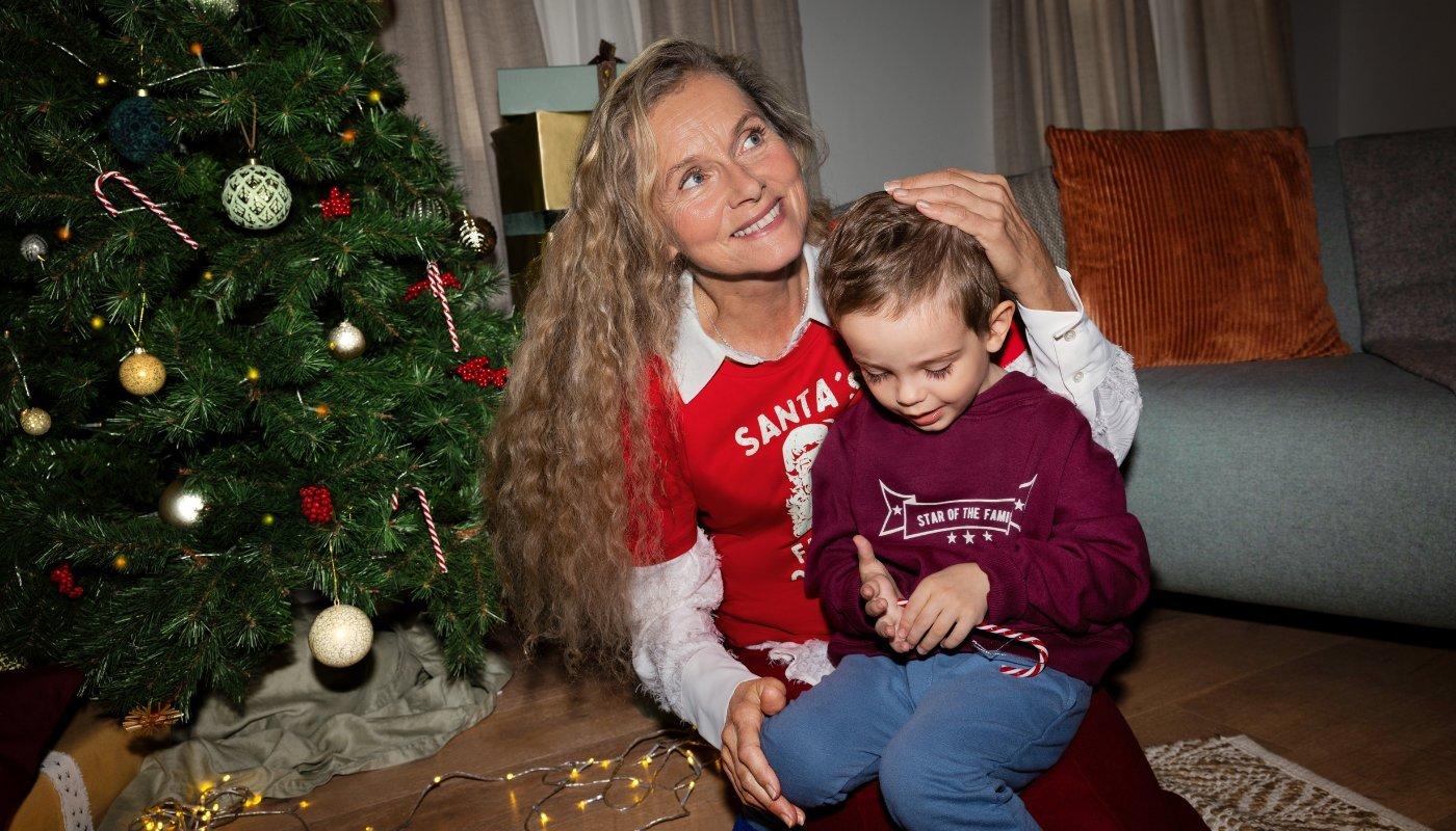 mom and child wearing holiday merch