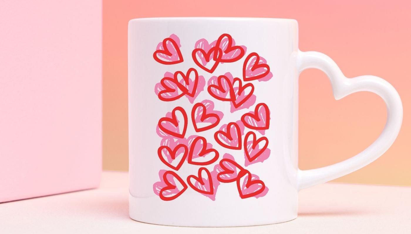 Heart-shaped handle mug with pink and red Valentine’s Day heart pattern design