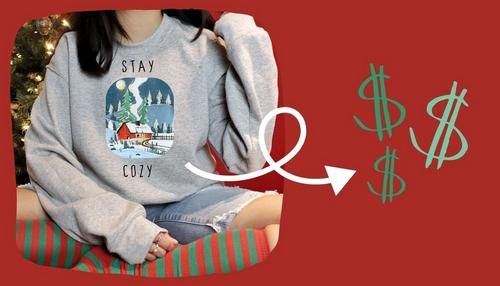 Holiday sweatshirt design with arrow pointing to dollar signs illustrating how merch earns extra cash.