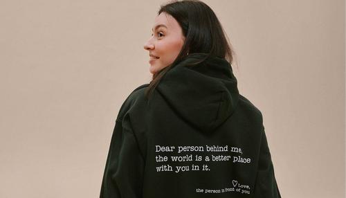girl wearing an inspirational design on hoodie