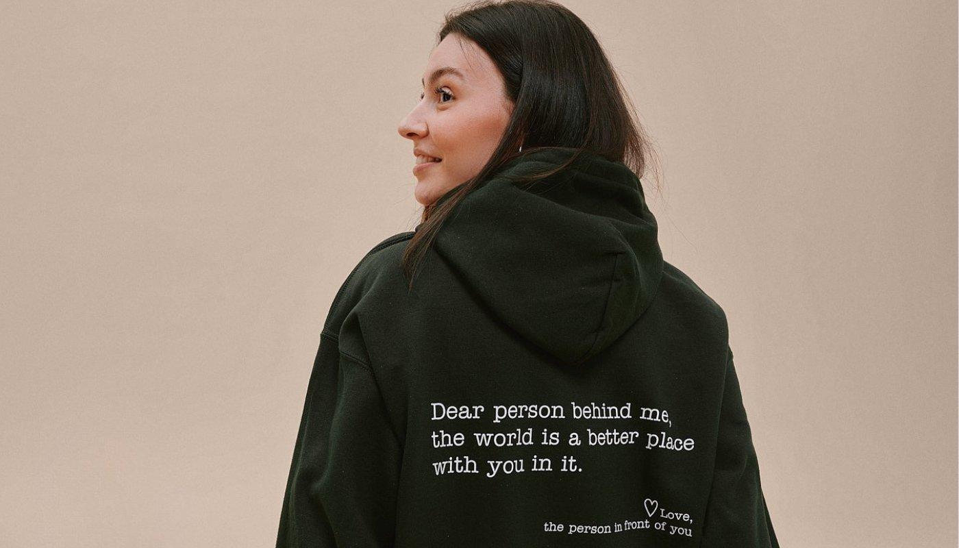 girl wearing an inspirational design on hoodie