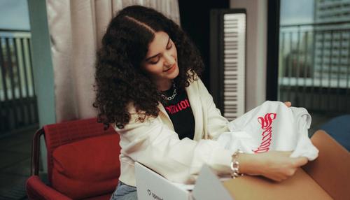 creator opening up their merch package