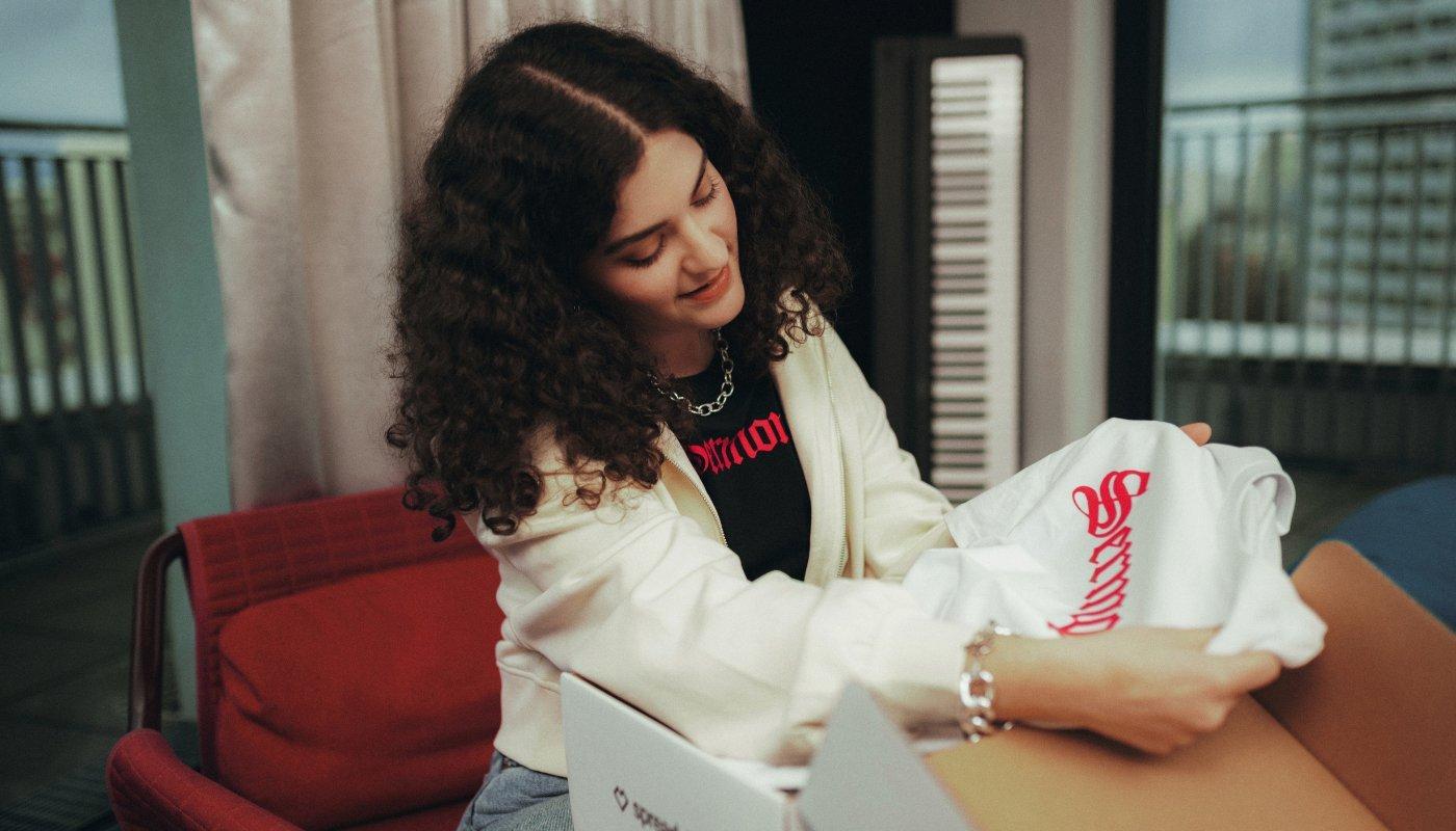 creator opening up their merch package