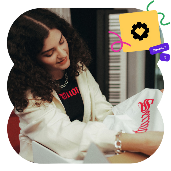 ecommerce seller looking at their print on demand apparel from spreadconnect