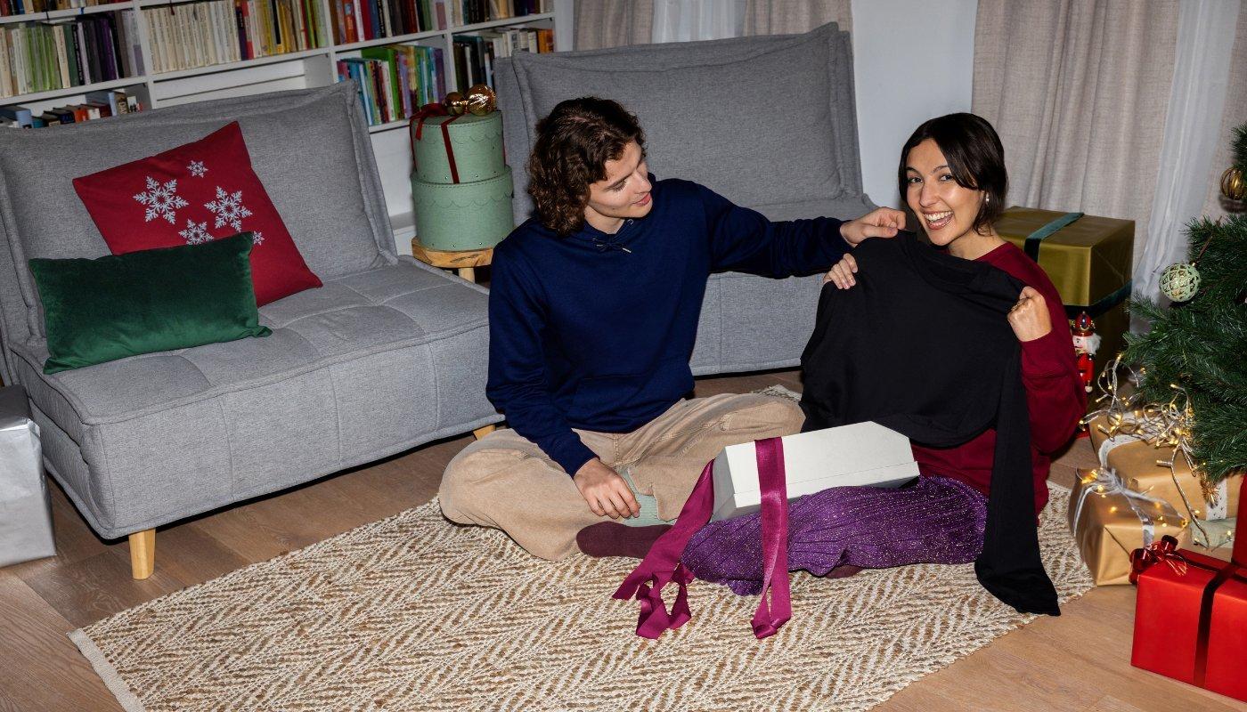 people opening up holiday gifts