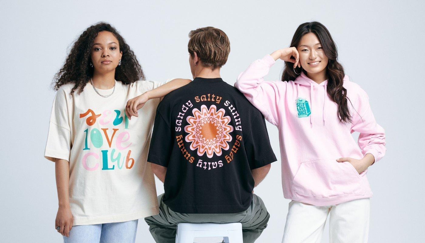 creator taking a photo wearing merch