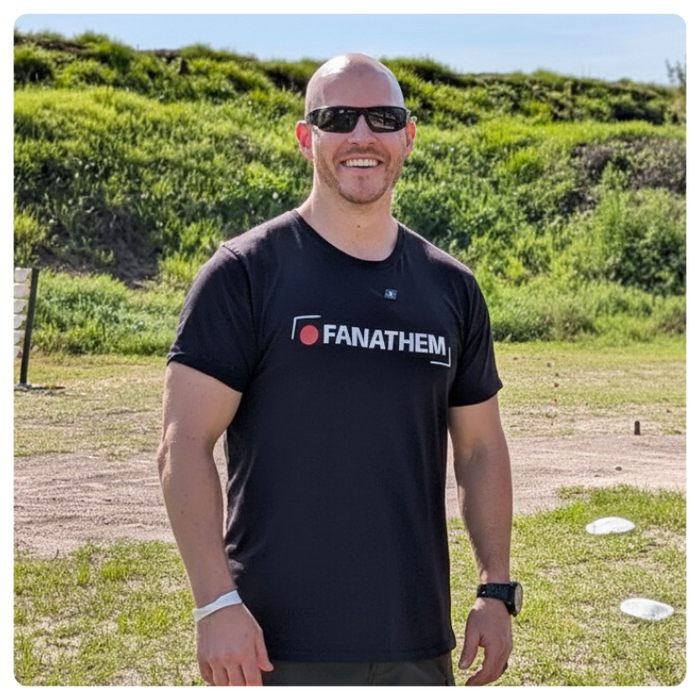 spreadconnect seller eric basek from fanathem apparel modeling one of his t-shirts in an outdoor setting