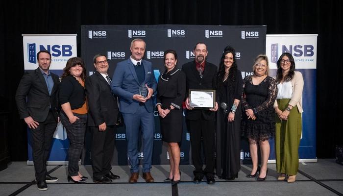spreadshirt employees accepting the award for large business of the year at the 2025 las vegas business of the year awards