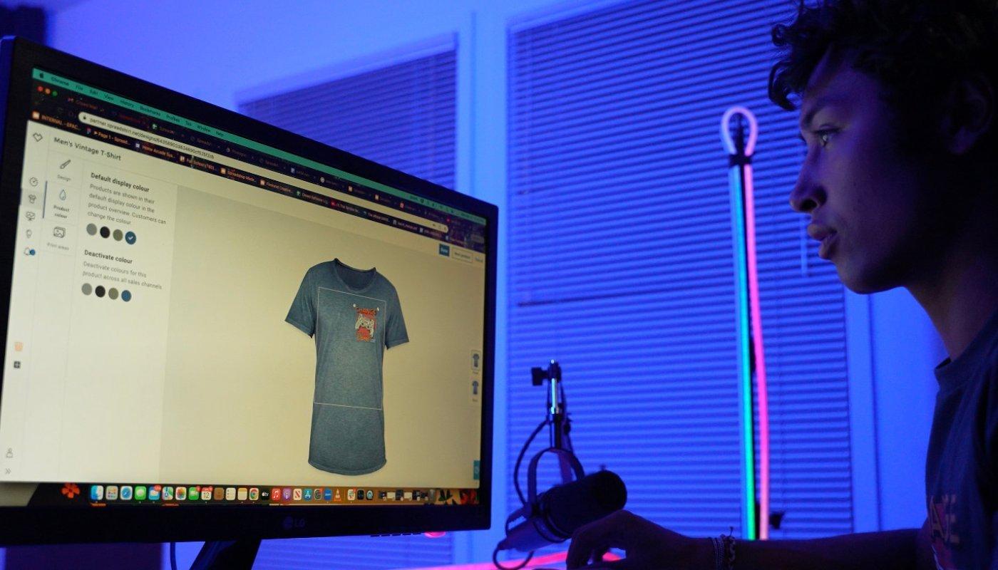 creator designing their t-shirt before they sell it