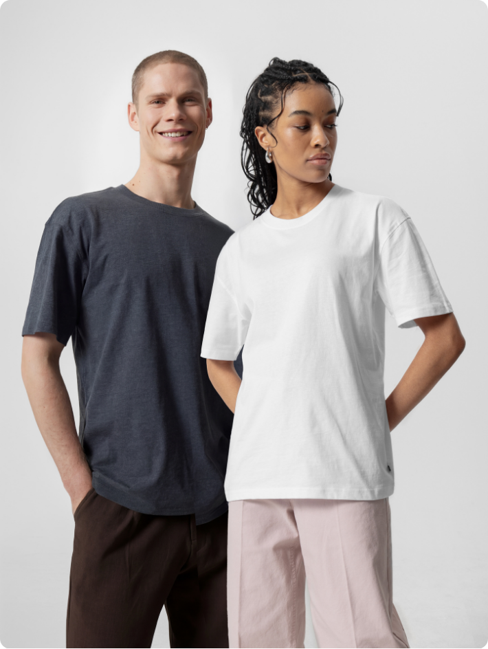 male and femal model wearing different colored versions of unisex oversized tshirt