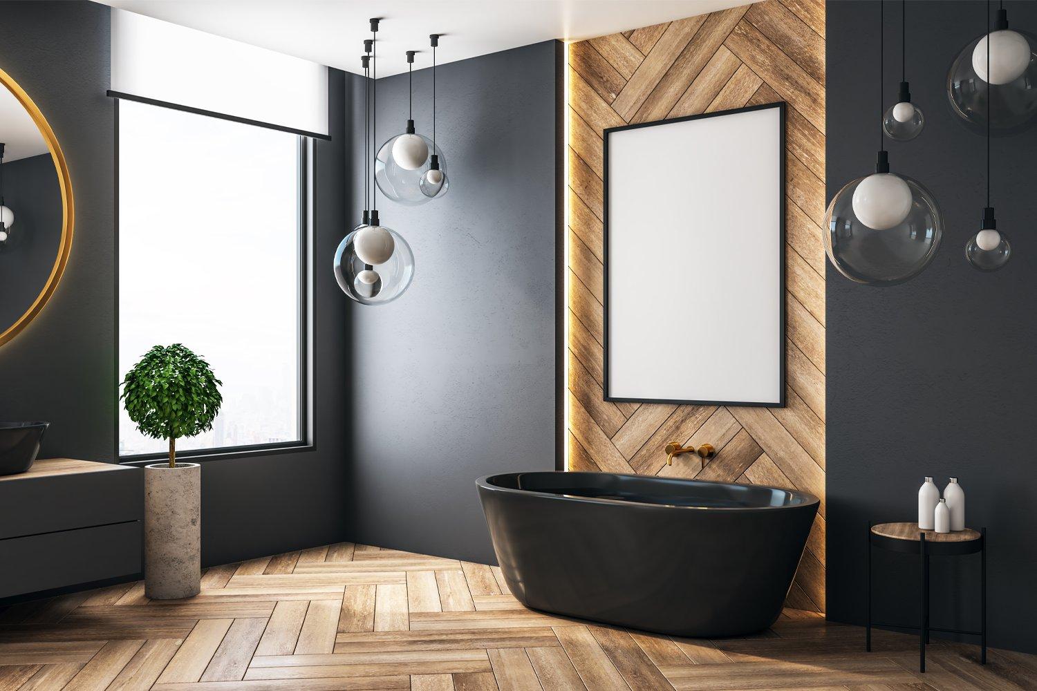 Modern bathroom with wood floors and black freestanding tub