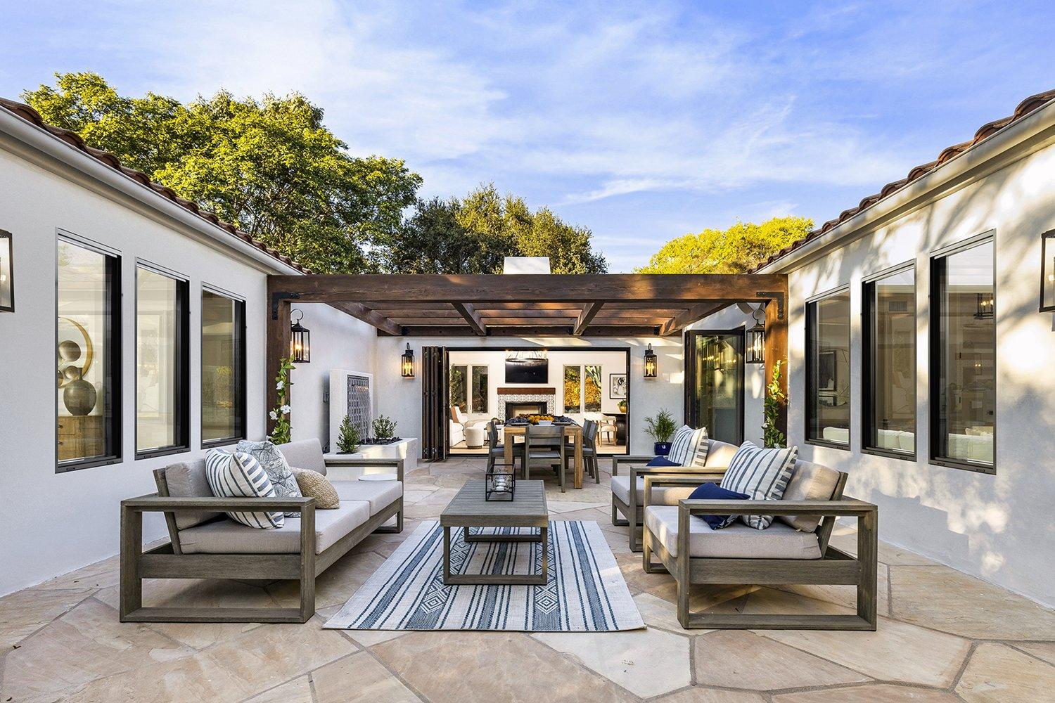 House Courtyard featuring LaCantina Folding Doors and V2 Direct Set Windows