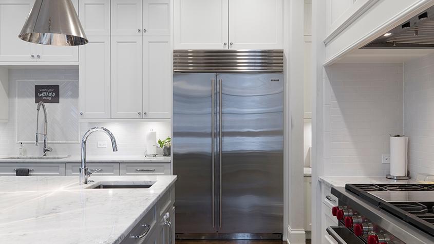 Image of an upgraded kitchen with a stainless steel fridge