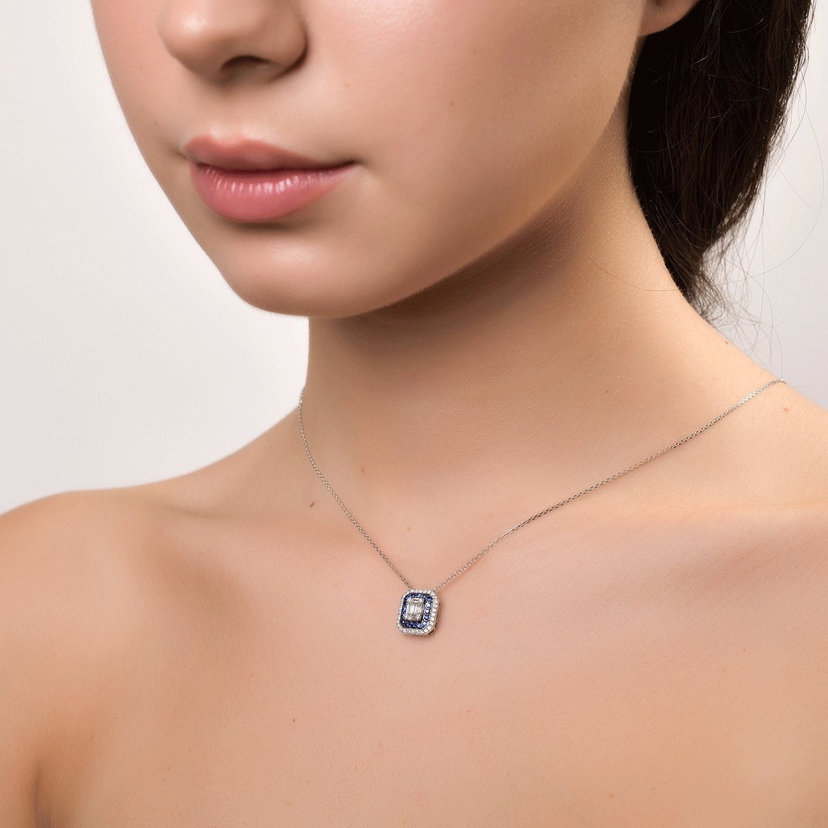 18K white gold pendant necklace with 0.74ct diamonds and 0.222ct sapphires