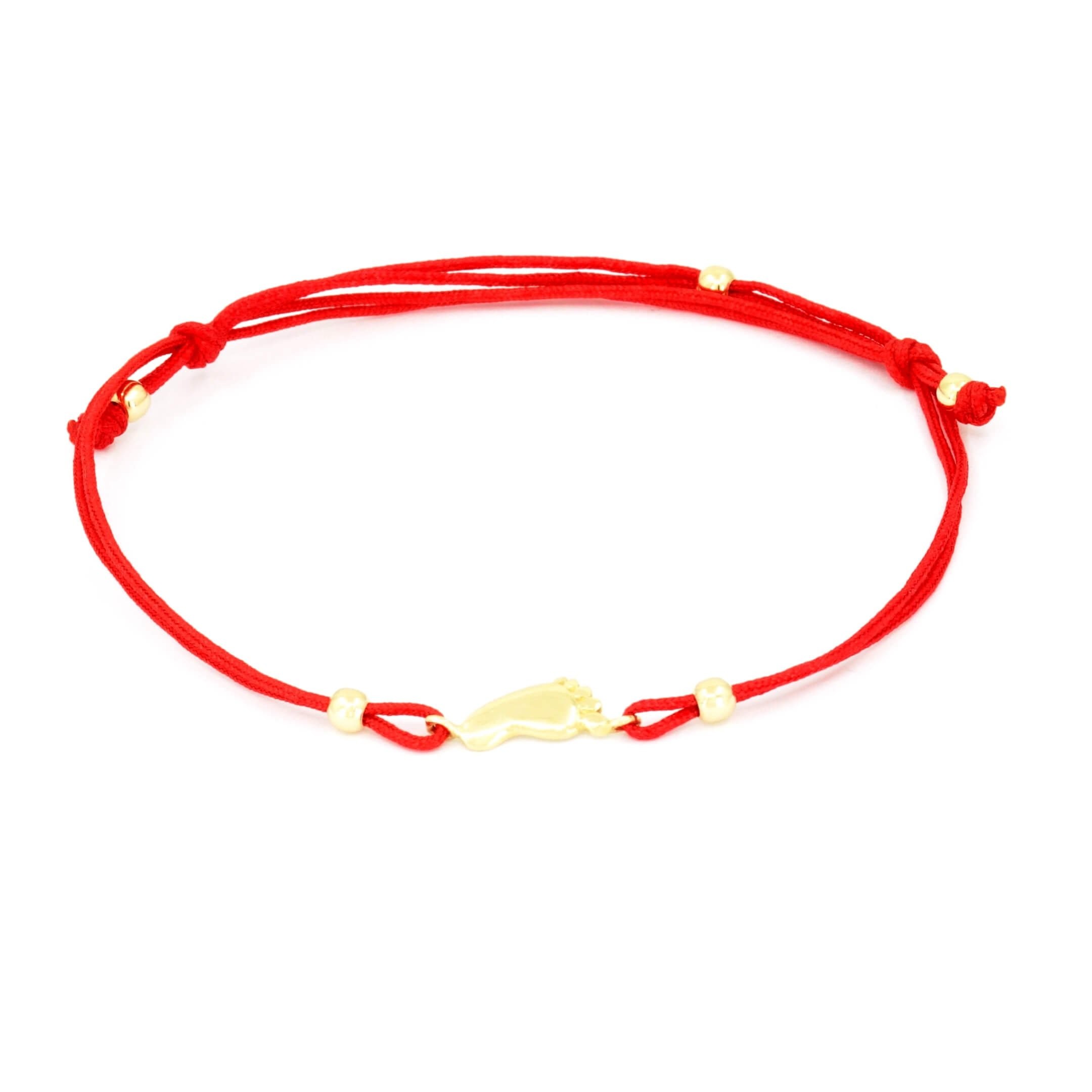 Red cord bracelet with 14K yellow gold baby feet charm
