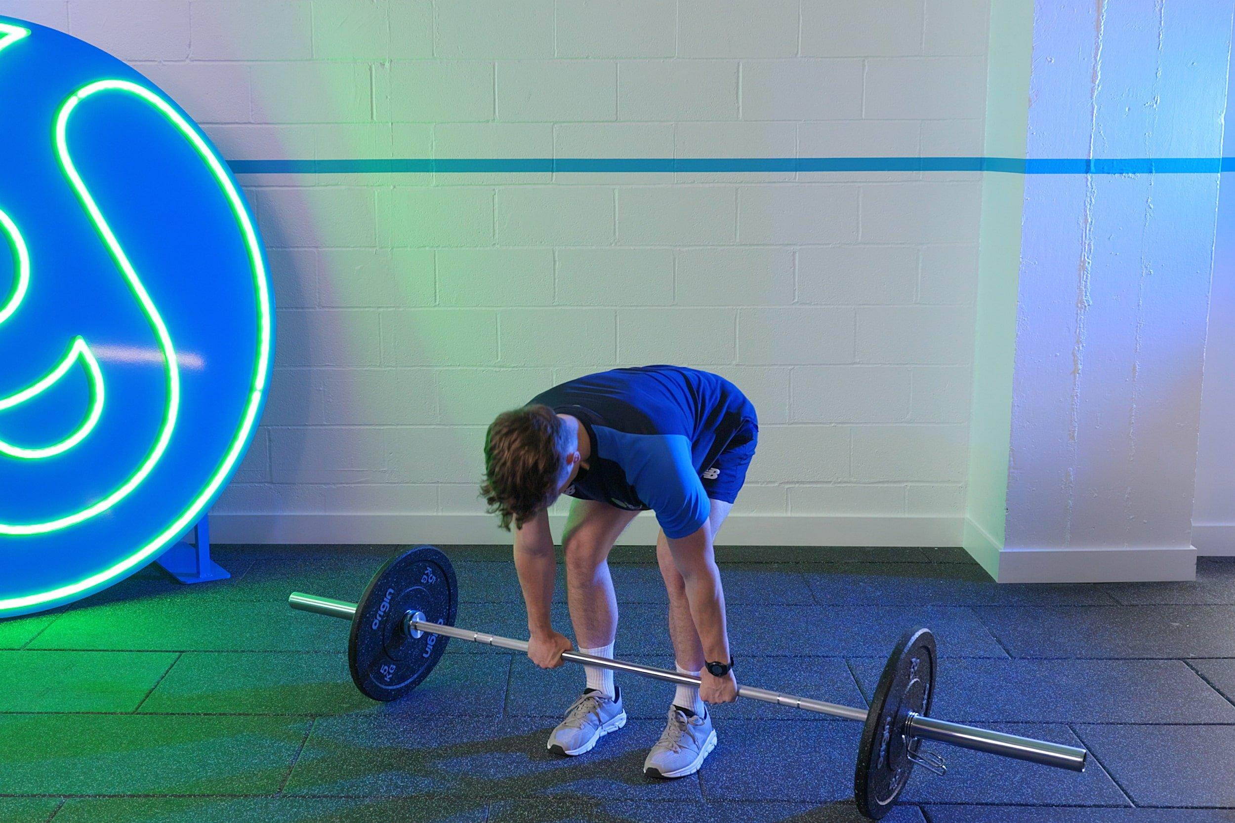 Member doing romamian deadlifts