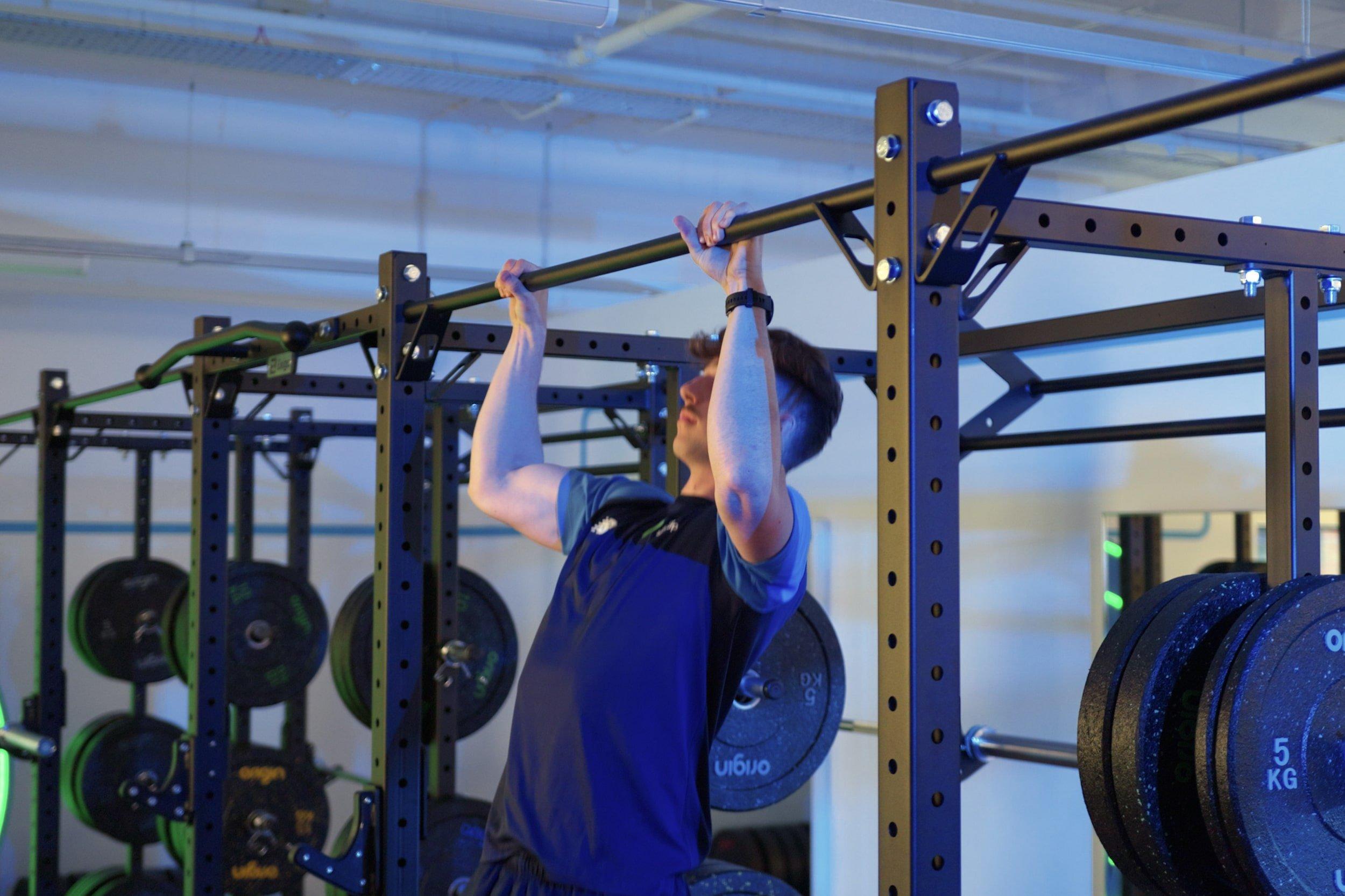 member doing pull ups