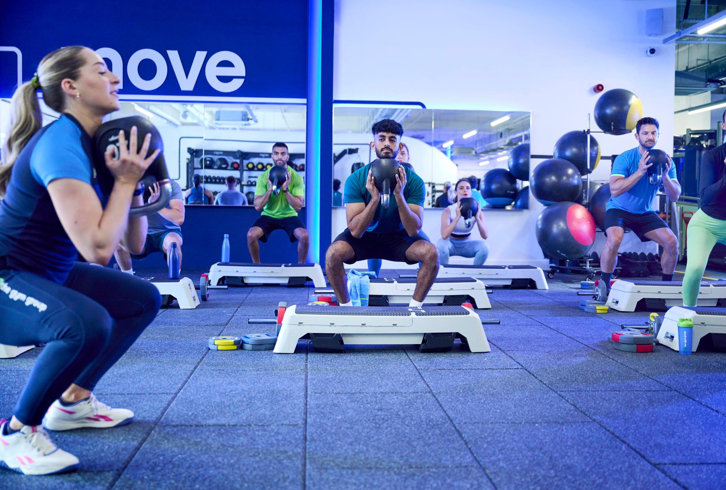 Gym members at a leg class