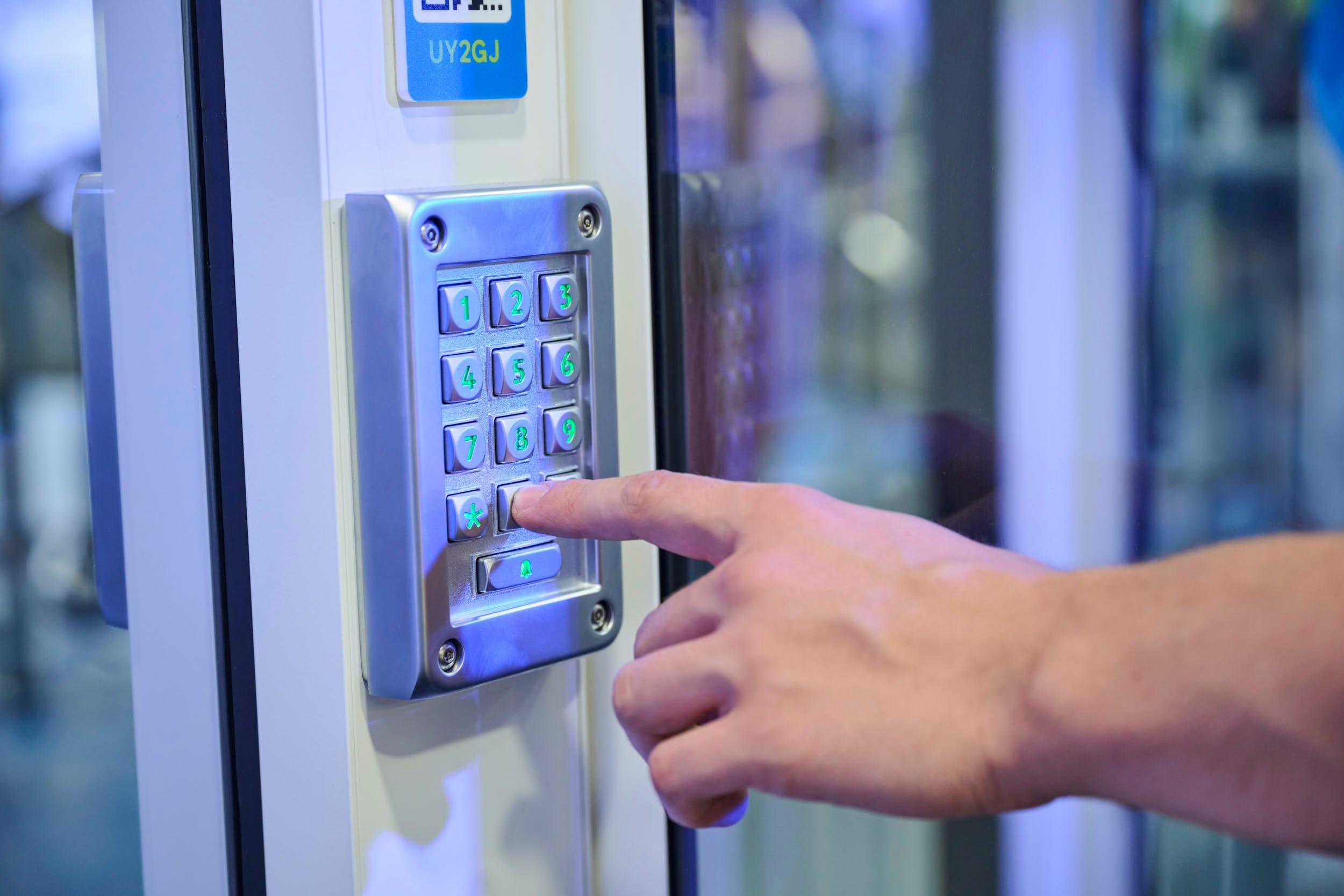 Member typing their pin at gym entrance