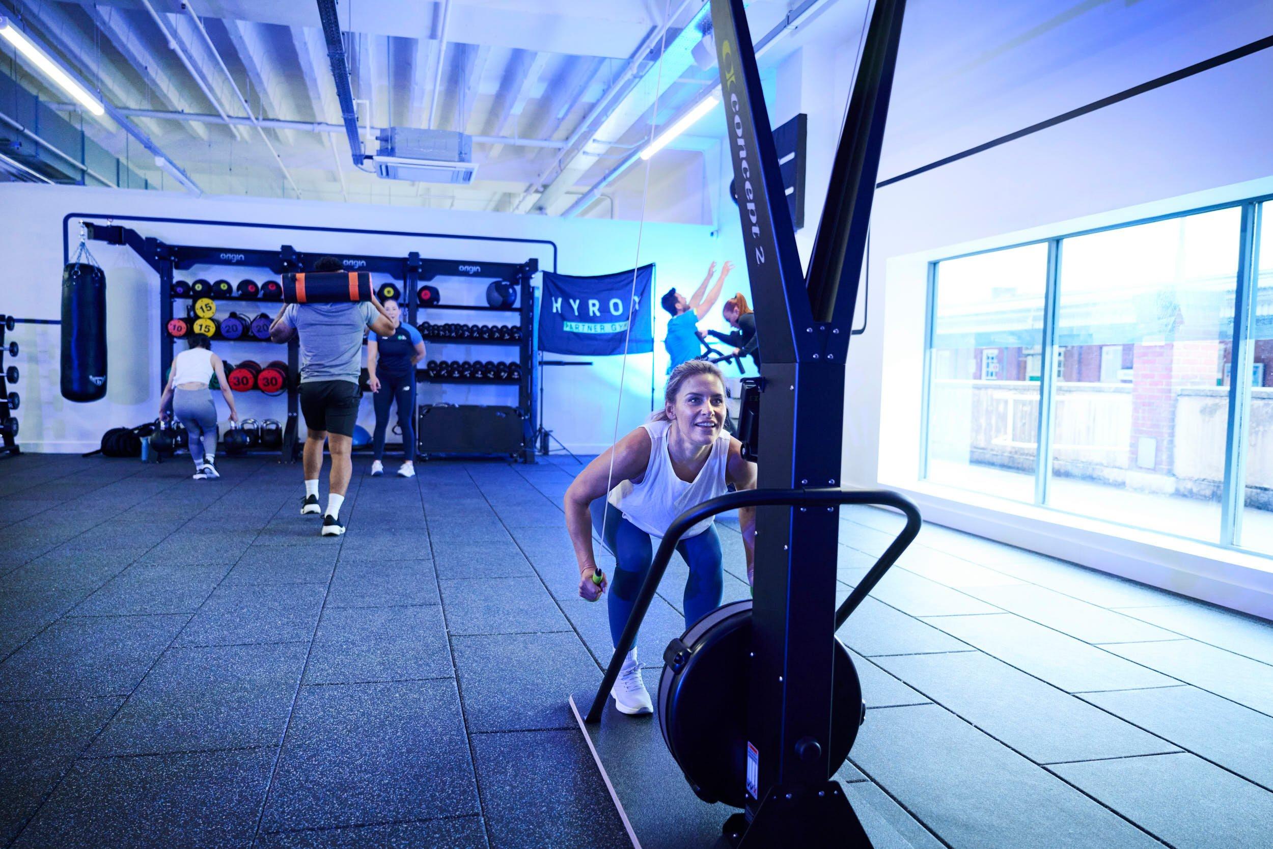 gym member training a hyrox race with ski erg