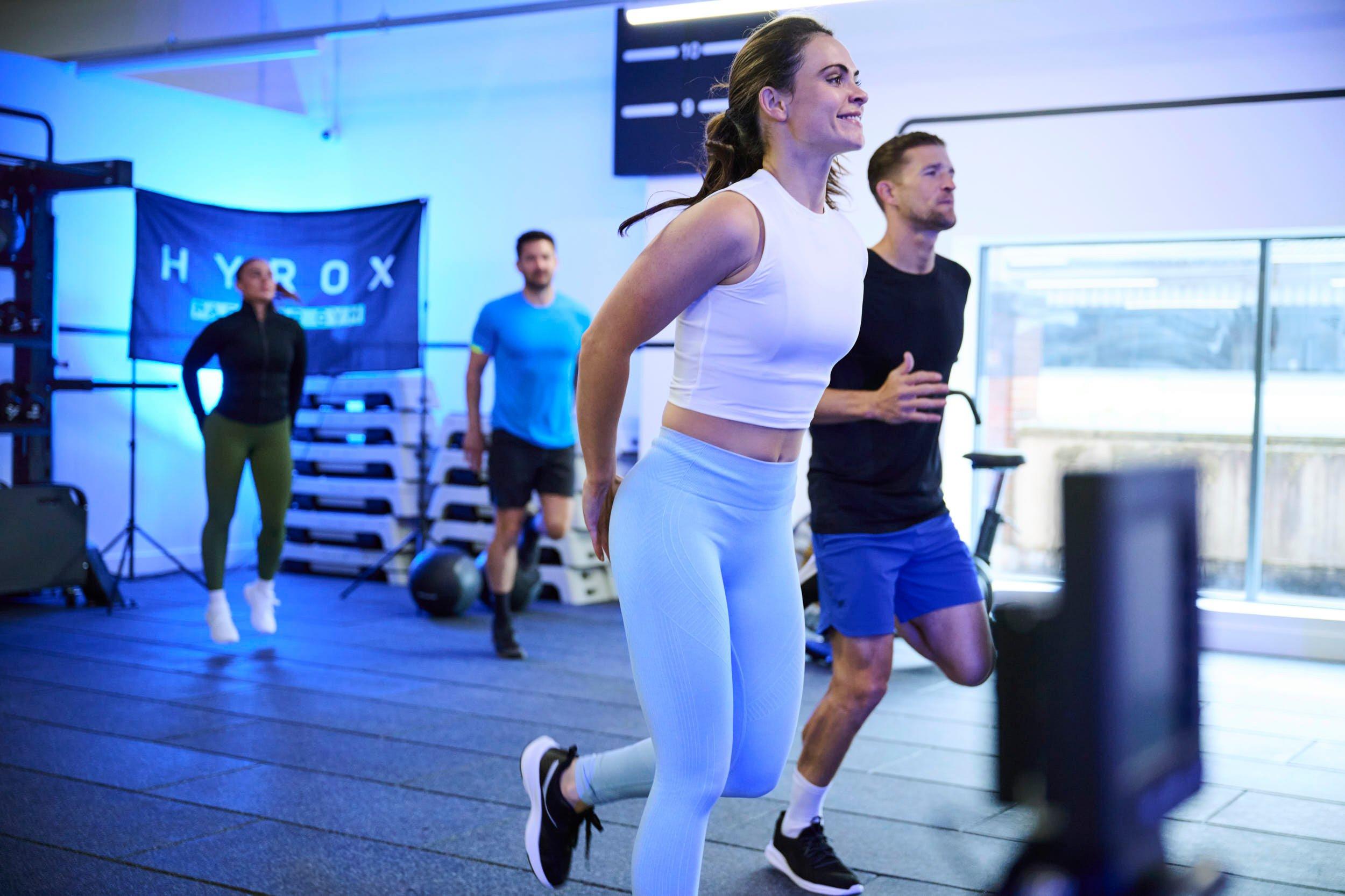 Member running lifting heels at gym class