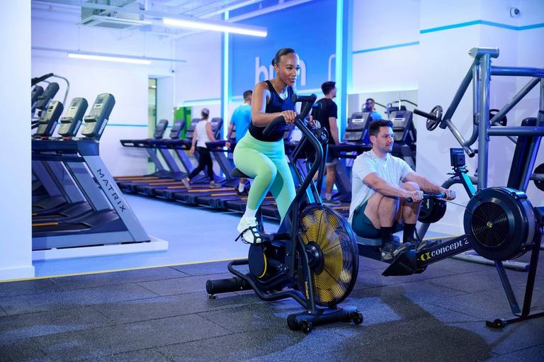 Members using air bike at the circuit gym class