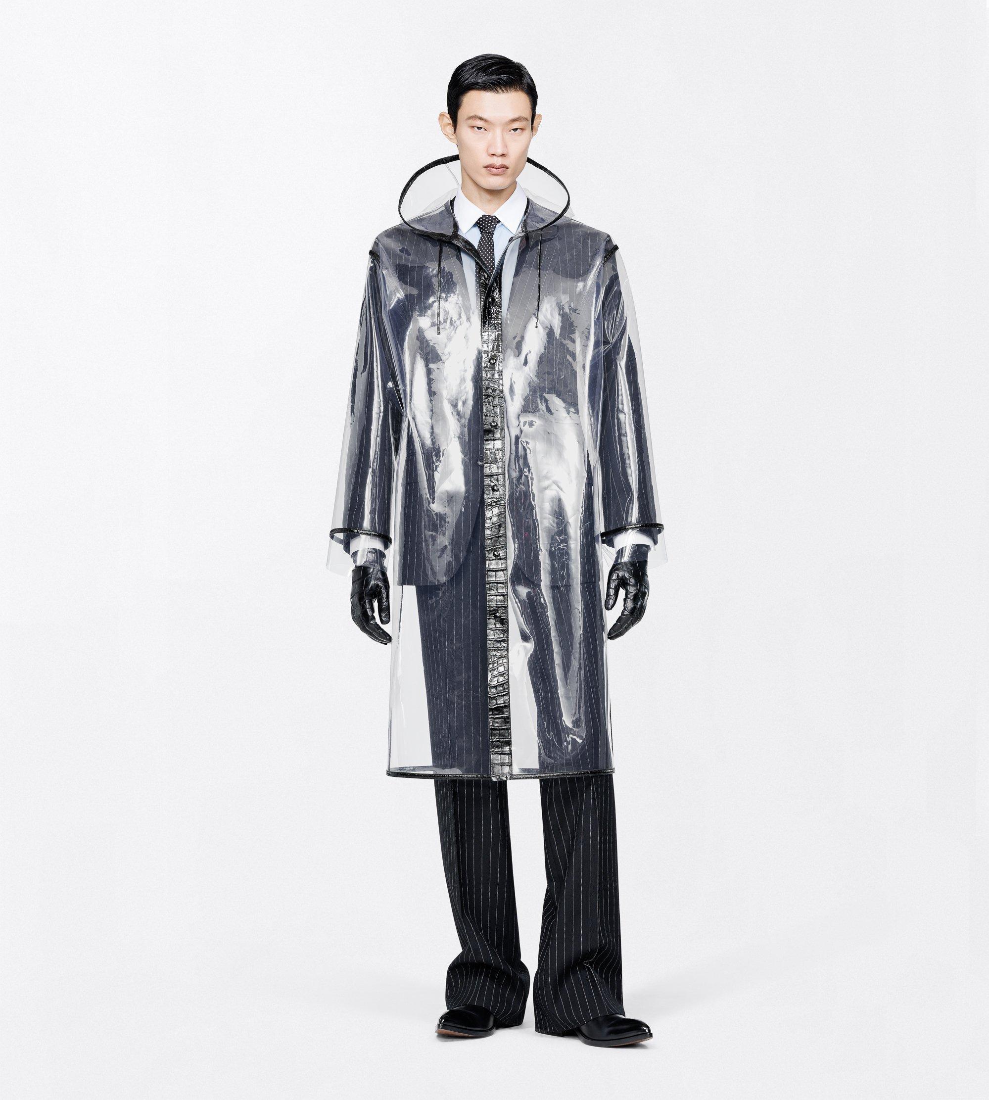 TRANSPARENT RAINCOAT WITH PRINTED LEATHER DETAILS