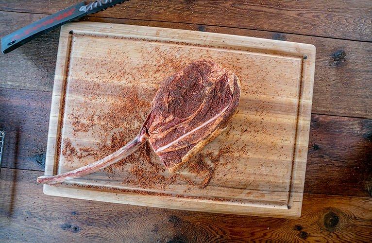 Seasoning-Tomahawk-Steak-Traeger-Grills