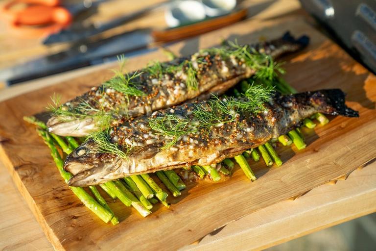 grilled-rainbow-trout-grilled-asparagus-charred-lemon-vinaigrette-recipe-traeger-pellet-grills