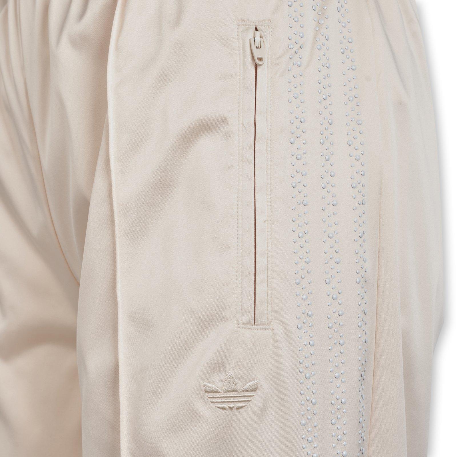 White Pearl Firebird Loose Trackpants (3229552) | Adidas