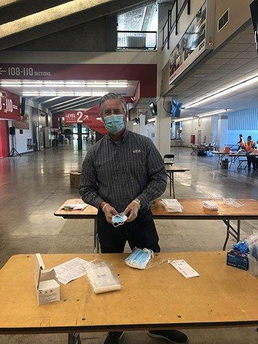 Don Smith, VP Petroleum helps to assemble PPE