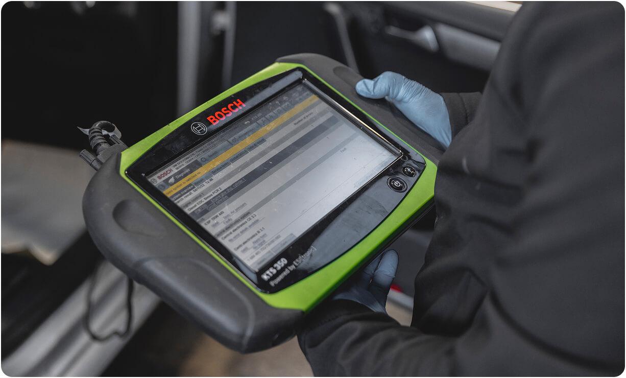 Technician reviewing a vehicle health report