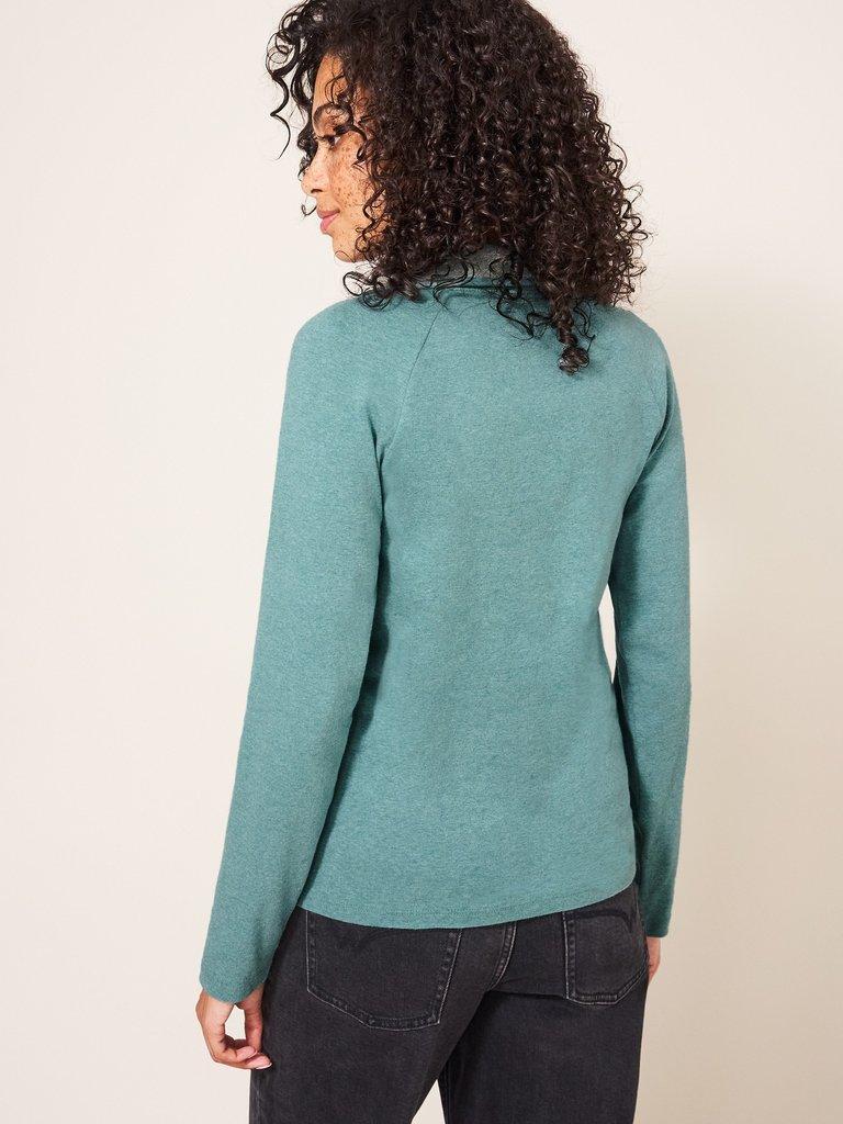 Billy Button Through Roll Neck in MID TEAL - MODEL BACK