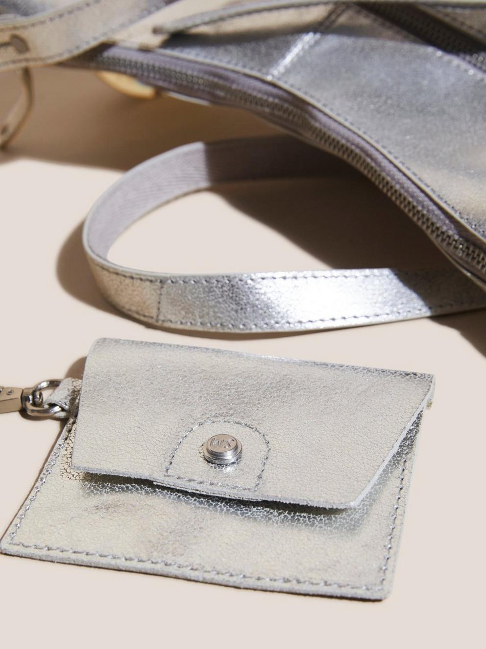 Fern Leather Crossbody in SLV TN MET - FLAT DETAIL