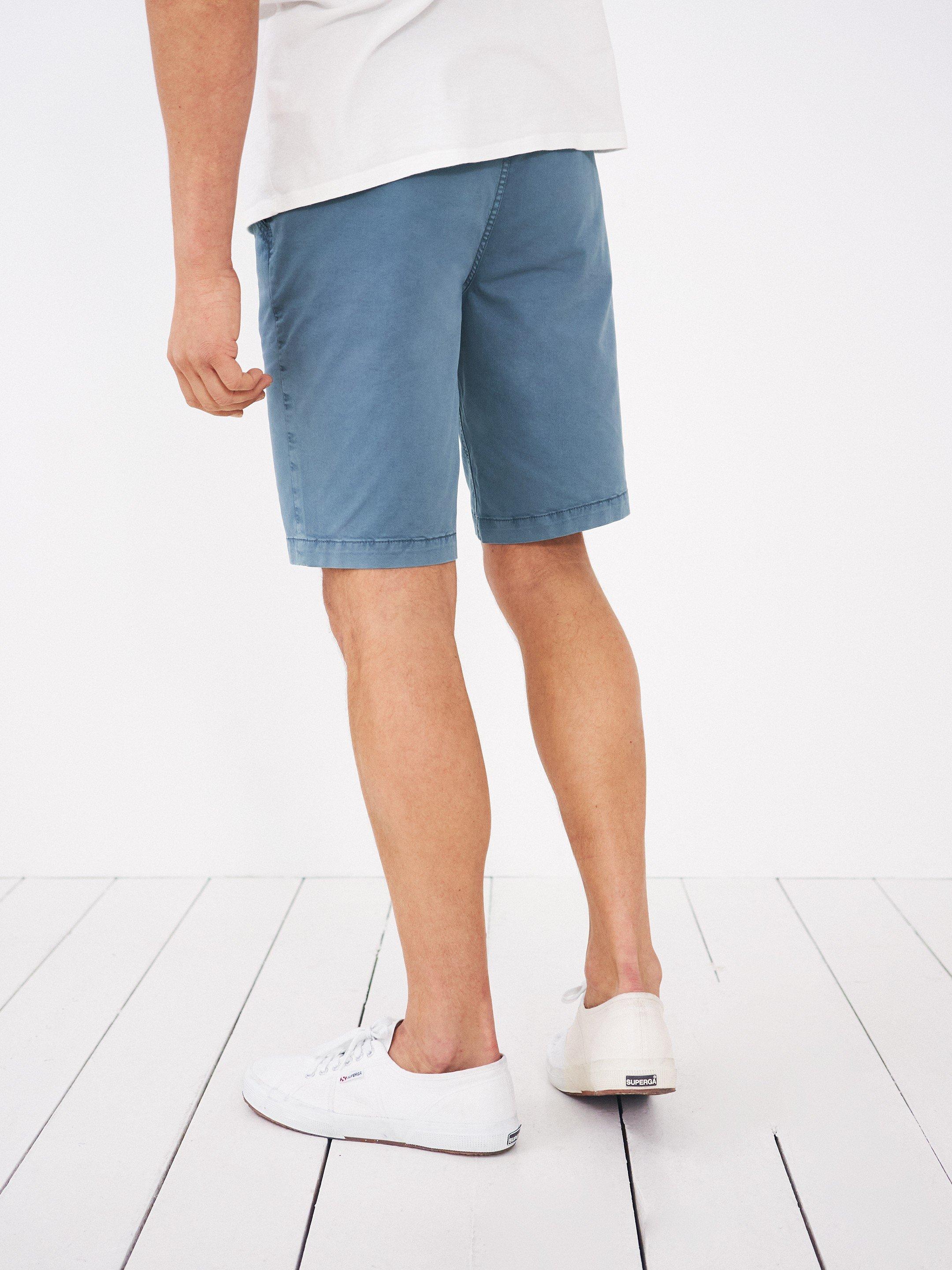Sutton Organic Chino Shorts in MID BLUE - MODEL BACK