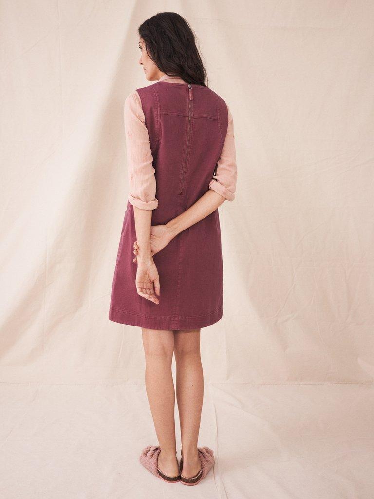 Janey Organic Cotton Pinafore in MID PLUM - MODEL BACK