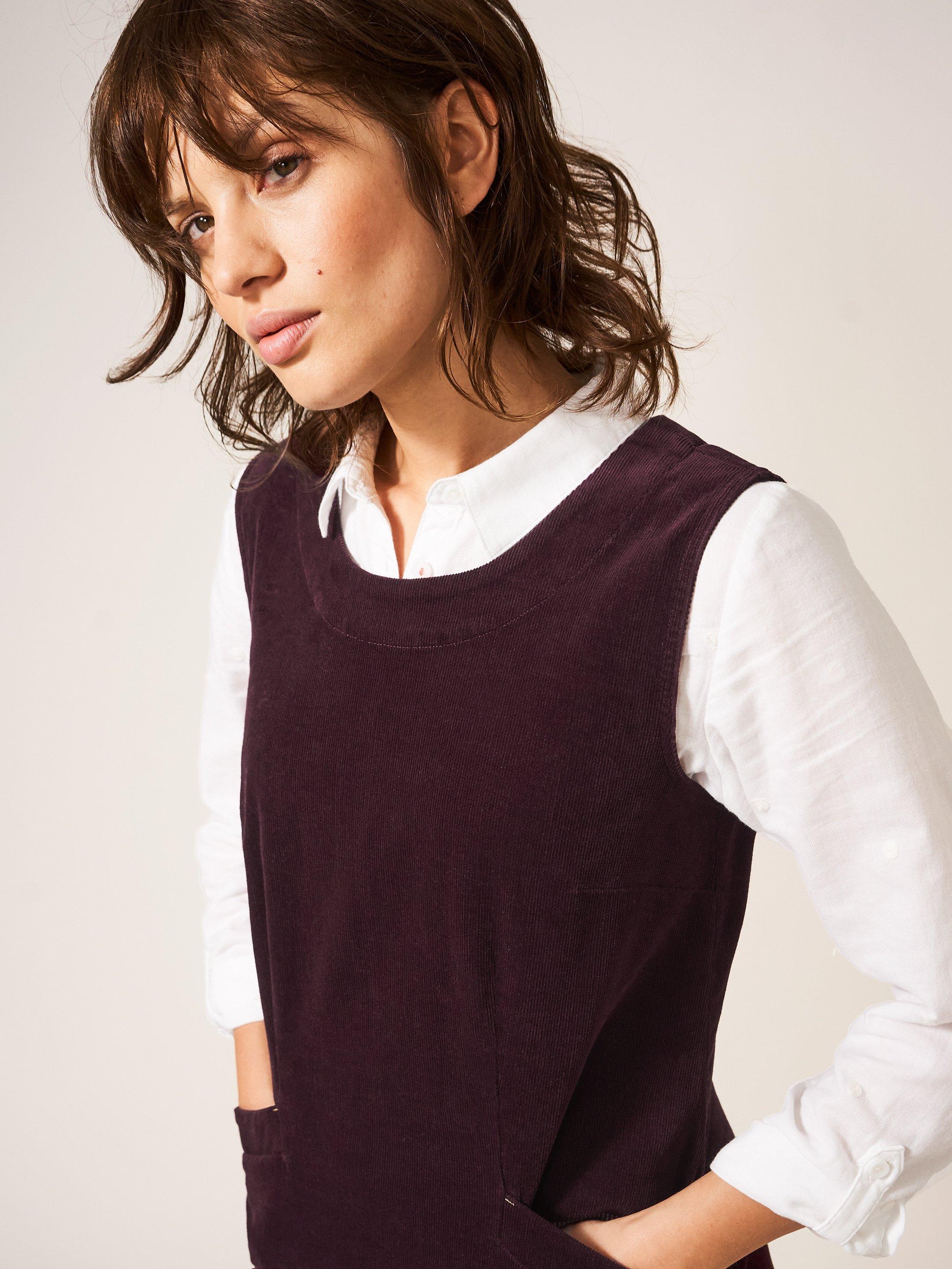 Lothbury Organic Cord Pinny in DK PLUM - MODEL DETAIL