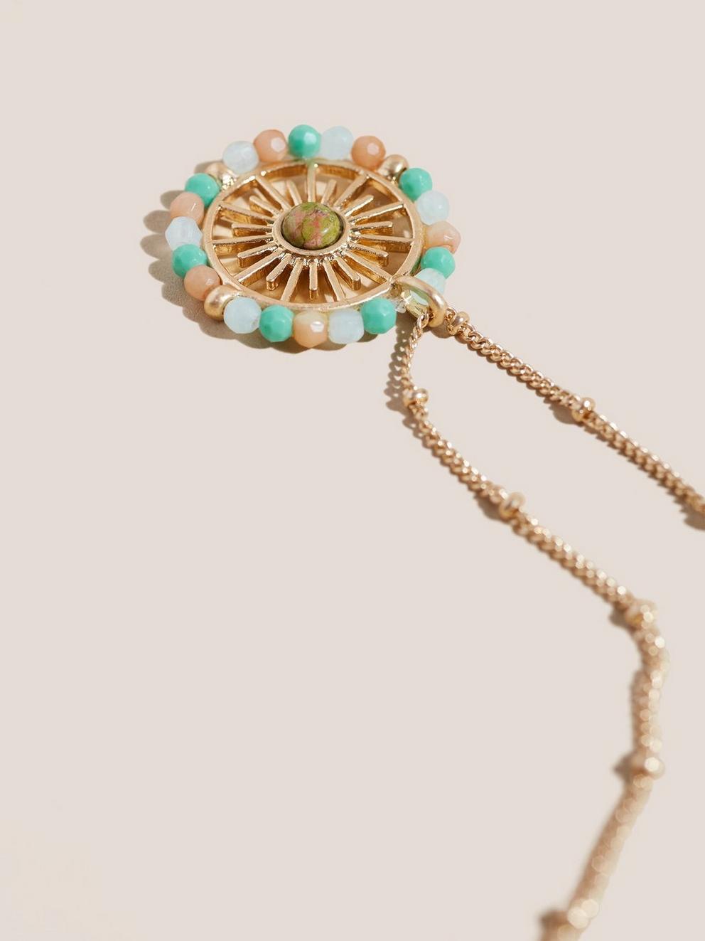 Beaded Sun Pendant in GLD TN MET - FLAT DETAIL