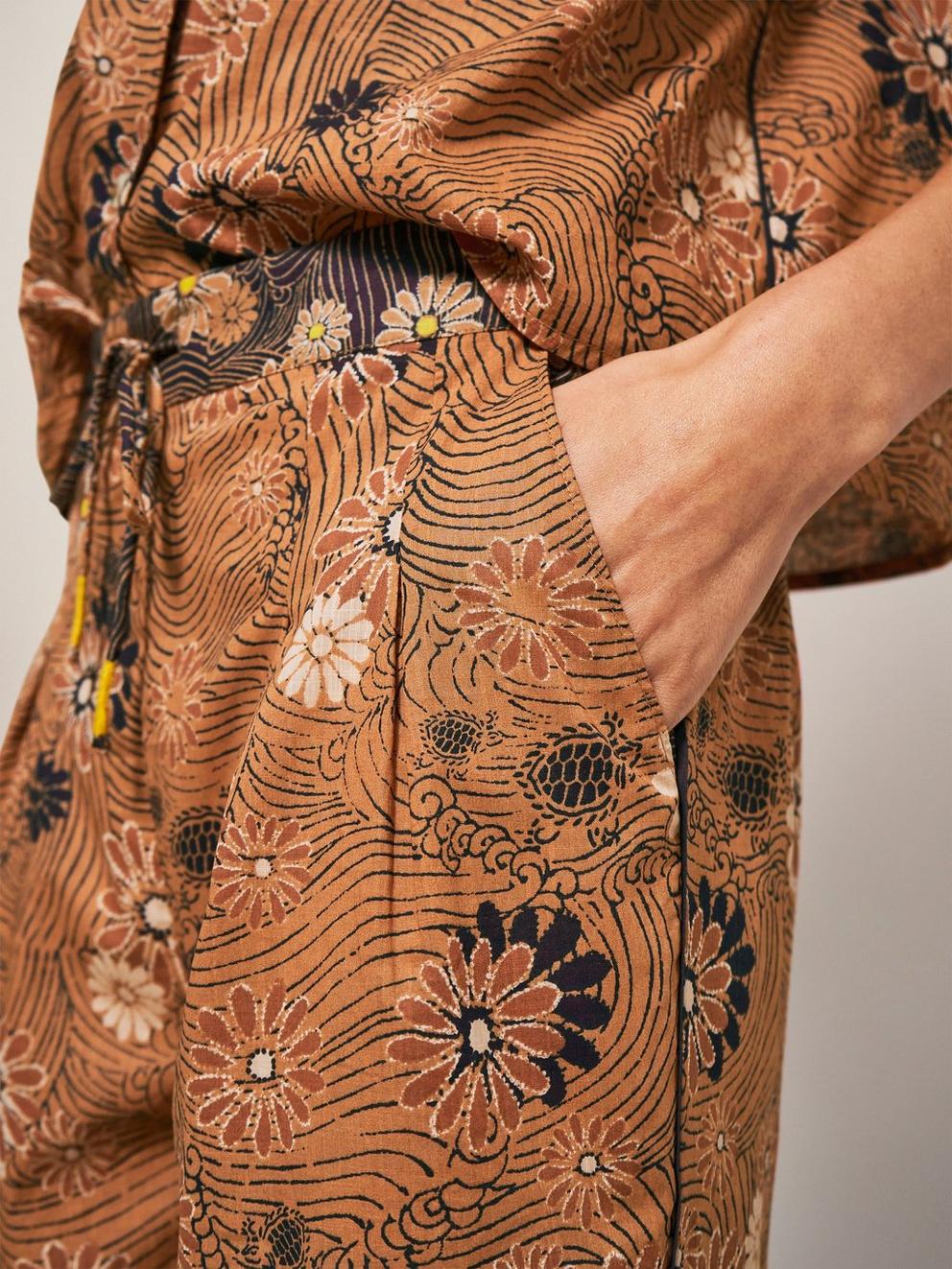 Paige Printed Trouser in ORANGE PR - MODEL DETAIL