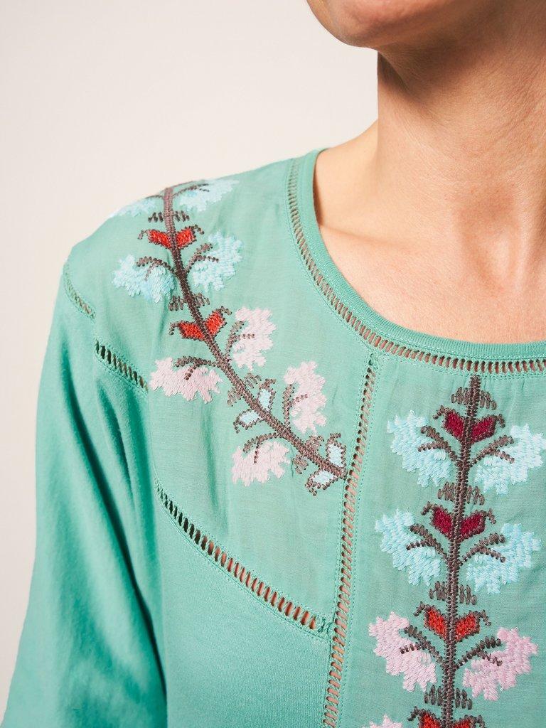 MOLLIE EMBROIDERED TOP in TEAL MLT - MODEL DETAIL