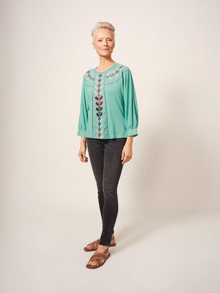 MOLLIE EMBROIDERED TOP in TEAL MLT - MODEL FRONT