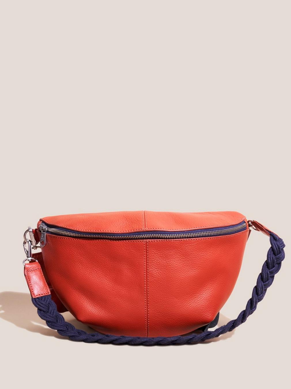 Sebby Leather Sling Bag in BRT ORANGE - MODEL FRONT