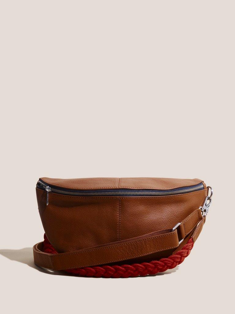 Sebby Leather Sling Bag in MID TAN - MODEL FRONT